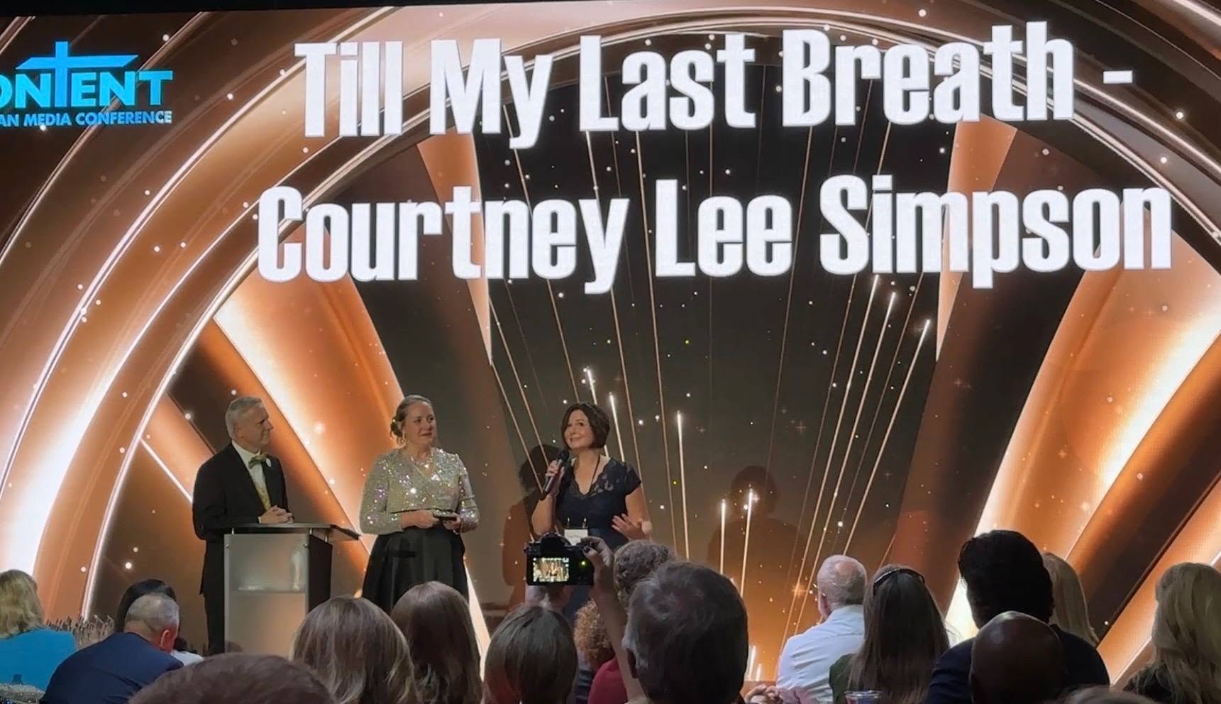 Courtney Lee Simpson with her Best Director award at the CONTENT Christian Conference